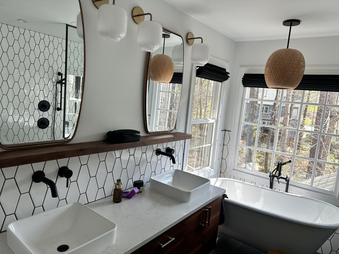 Double vessel-sink vanity with a white hexagon tile wall and matte black faucets — Triangle Home Handyman, Apex NC