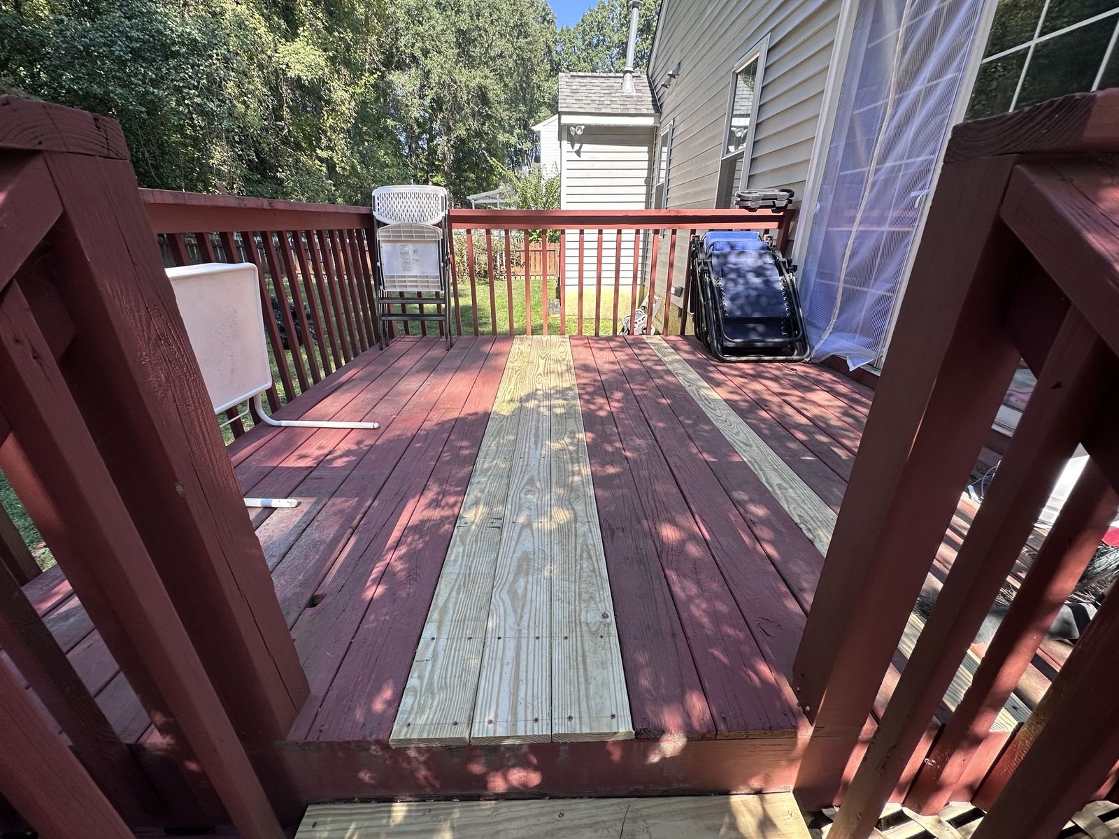 Backyard deck with strips of new replacement boards — Triangle Home Handyman, Apex NC
