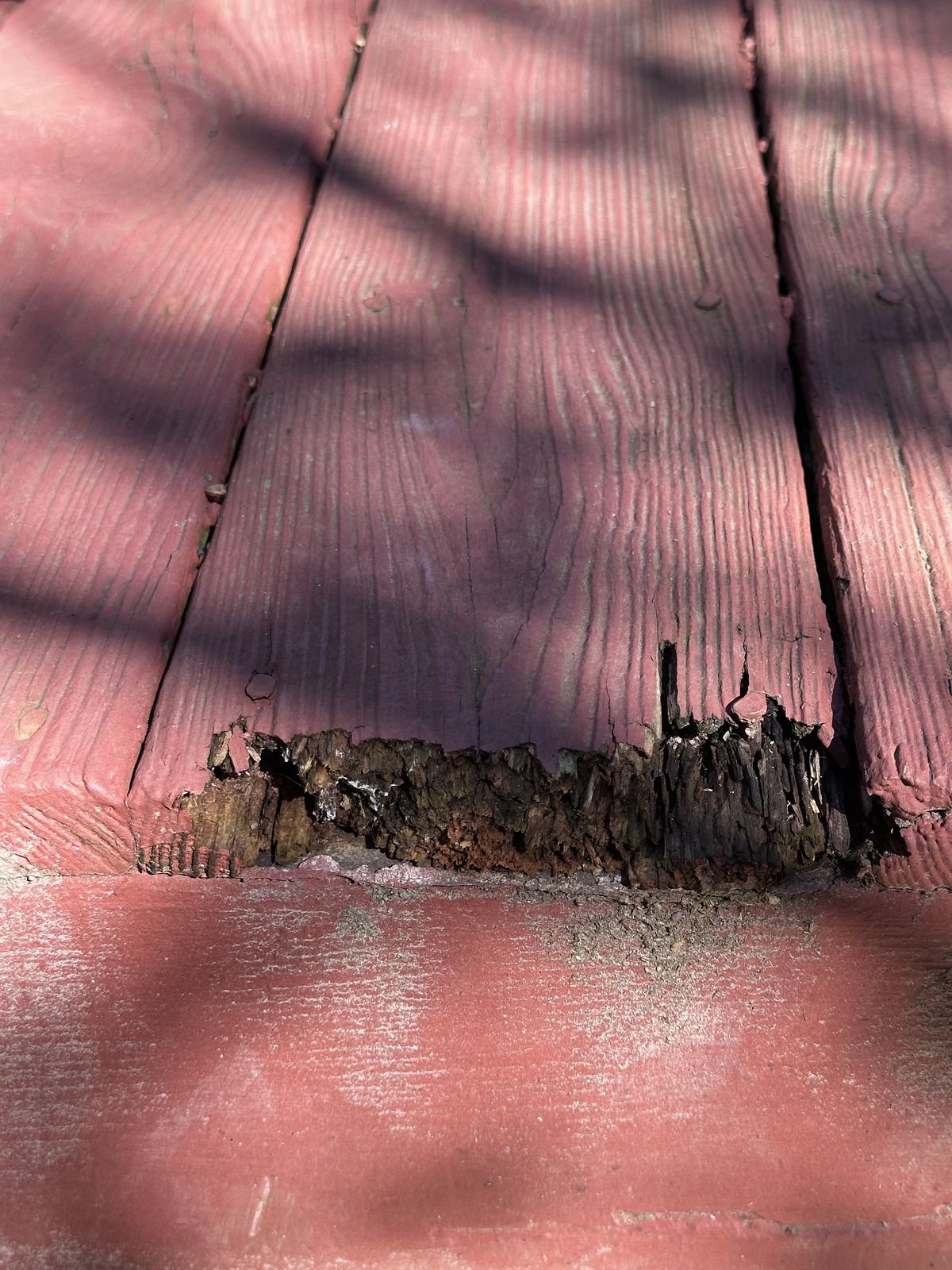 Rotted end of a deck board before repair, Holly Springs NC