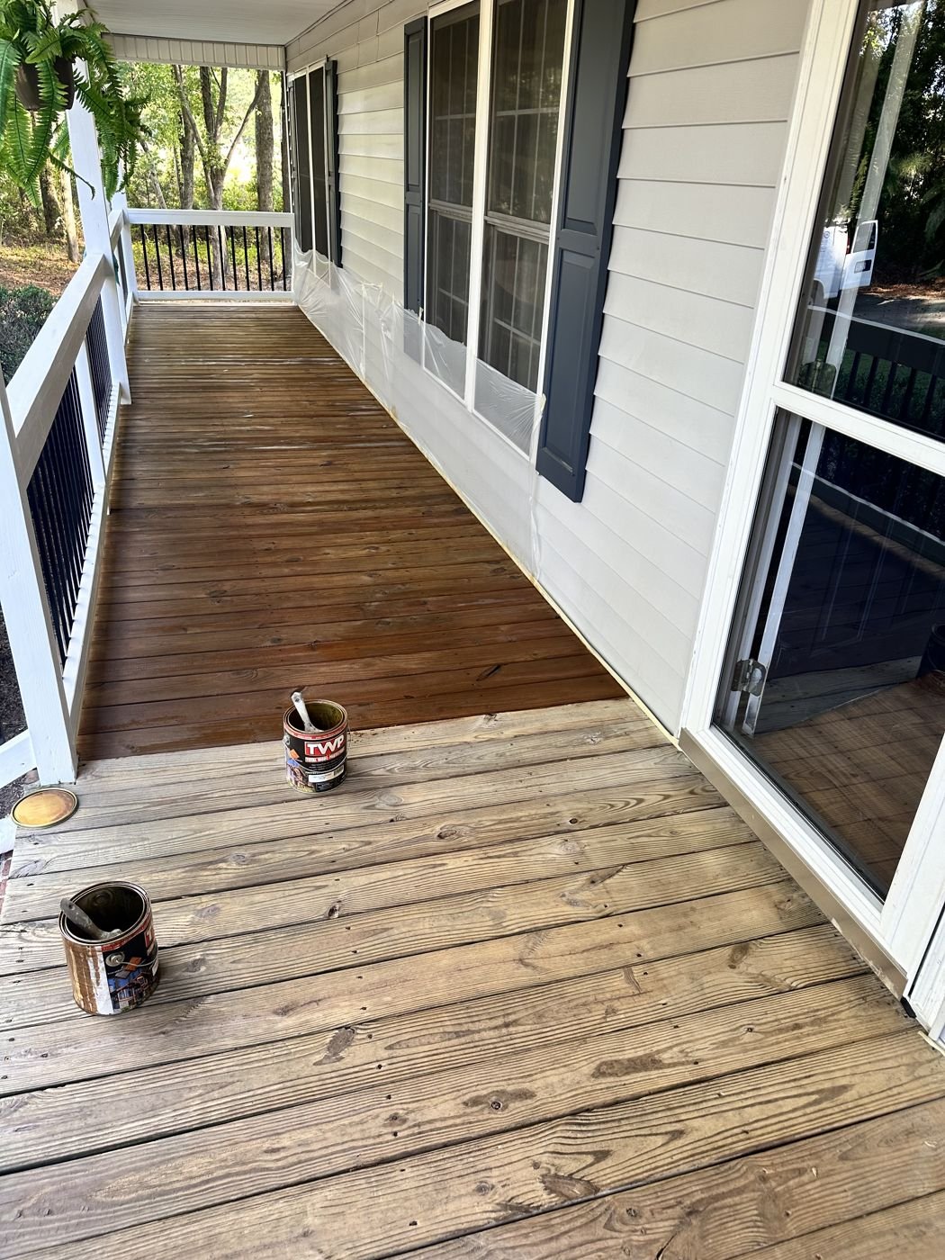 Front porch deck boards being stained — Triangle Home Handyman, Apex NC