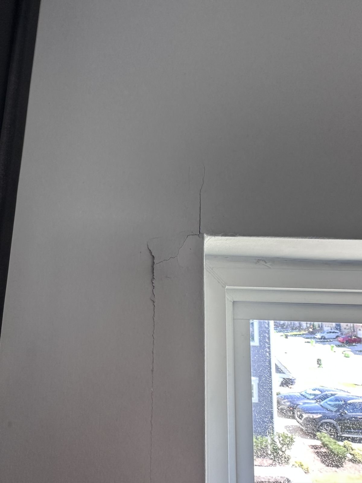Crack running down from the corner of a kitchen window before repair, Apex NC