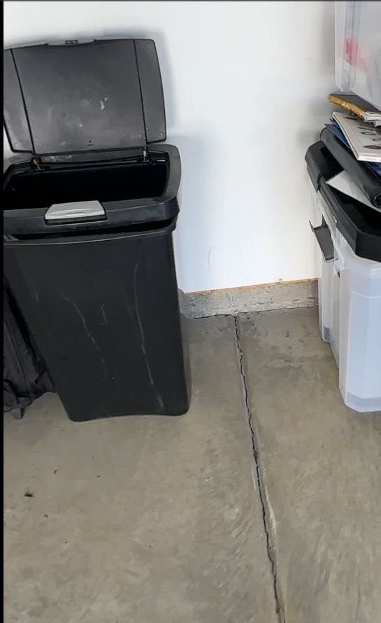 Long crack across a garage floor before repair — Triangle Home Handyman, Apex NC
