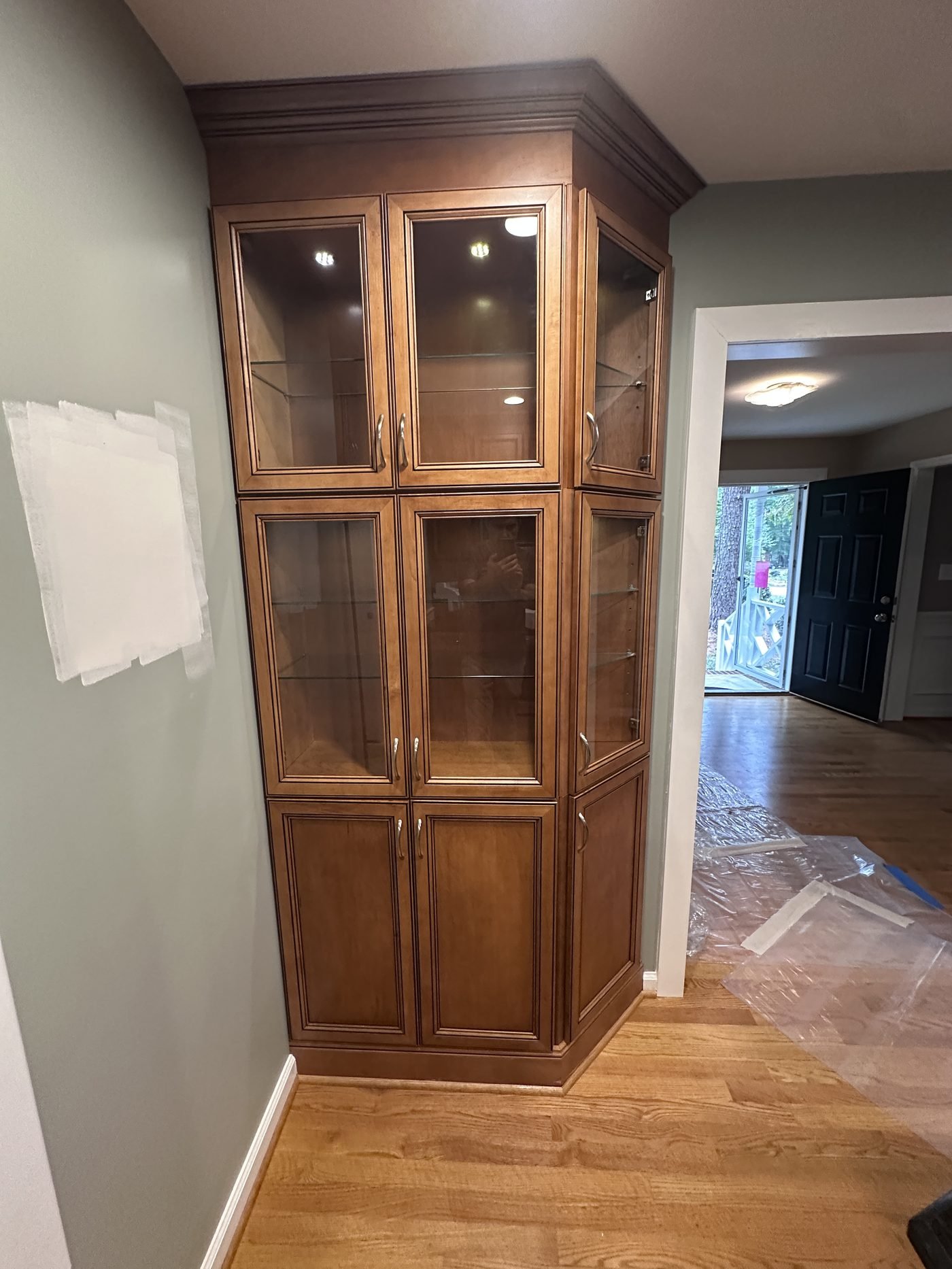 Kitchen with built-in wood cabinets and granite counter before removal
