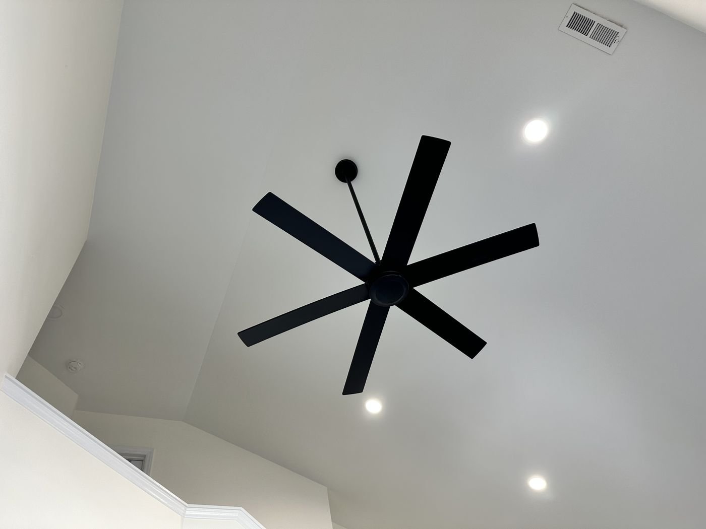 Black six-blade ceiling fan on a high ceiling — Triangle Home Handyman, Apex NC
