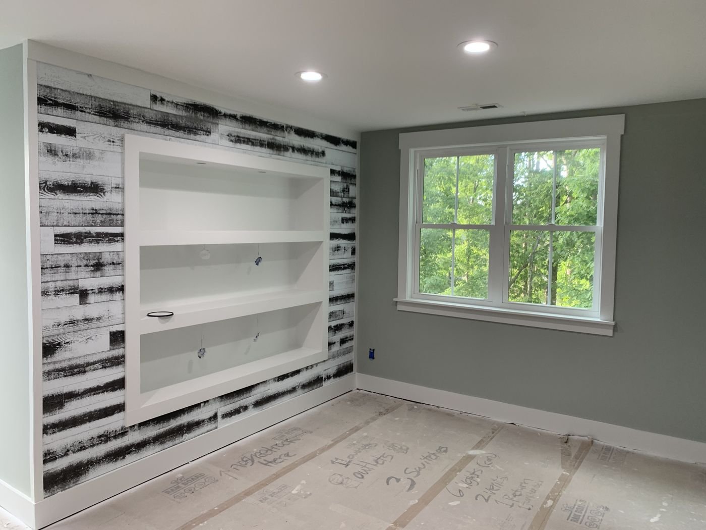 Built-in wall shelving with a distressed wood accent wall — Triangle Home Handyman, Apex NC